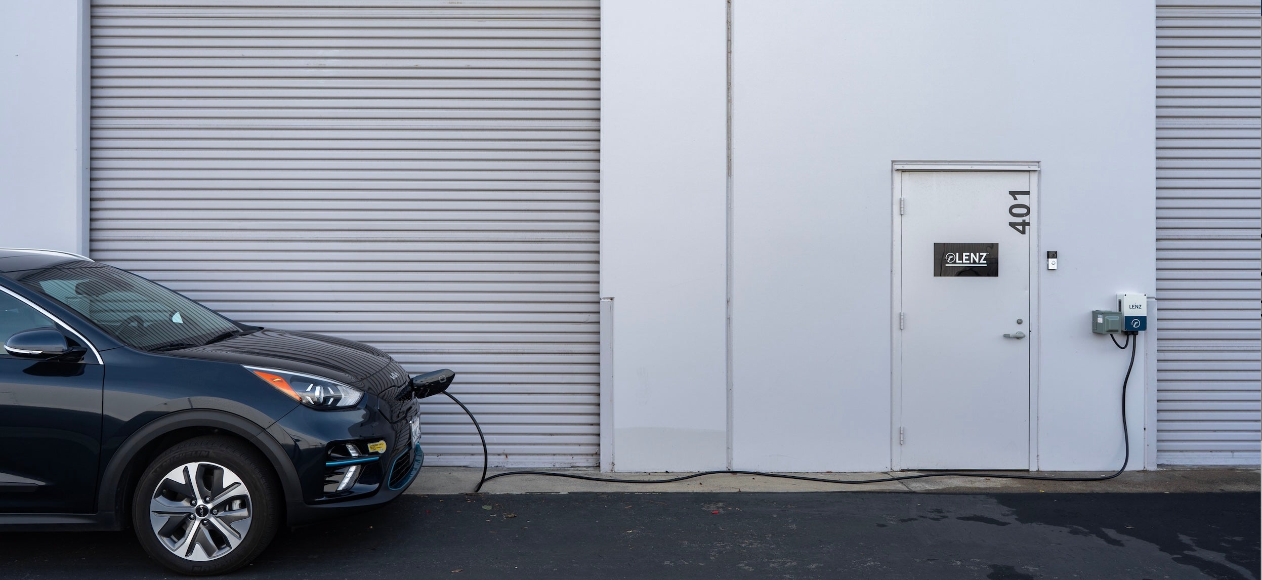LENZ OFFICE BACKDOOR WITH EV CHARGED BY LENZ LEVEL 2 EVSE