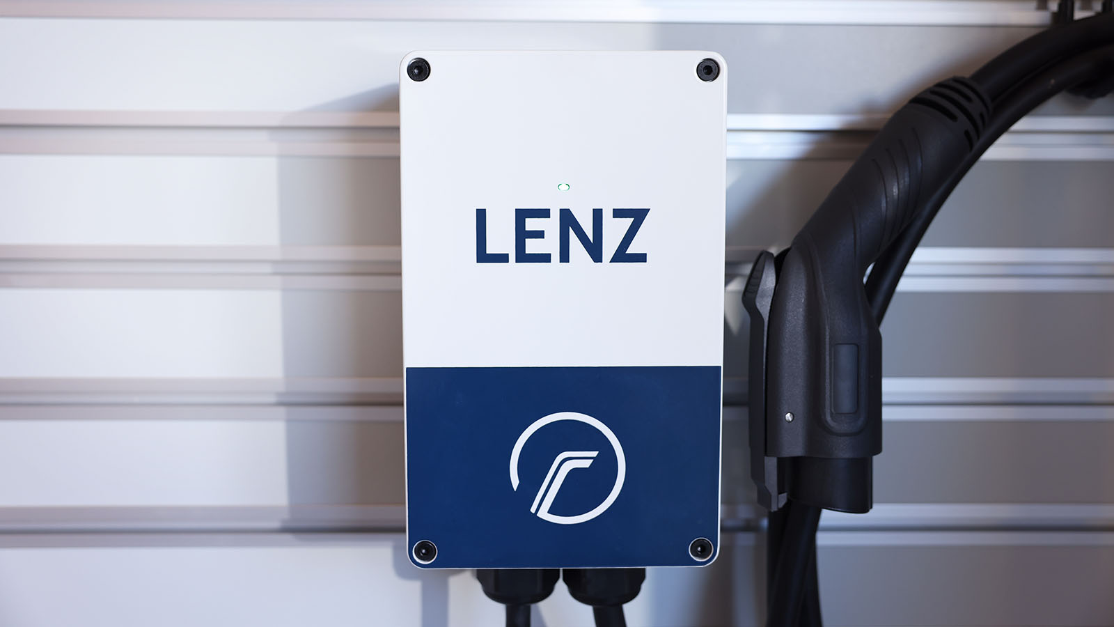 LENZ EVSE W401 Level 2 Home Charger mounted to wall with J1772 charging plug, links to EVSE page